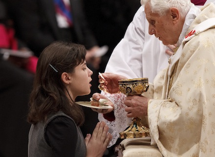 POPE GIVES COMMUNION TO GIRL DURING CHRISTMAS EVE MASS AT VATICAN