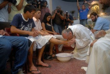 Cardinal Jorge Mario Bergoglio washes and kisses the feet of residents of a shelter for drug users during Holy Thursday Mass in 2008