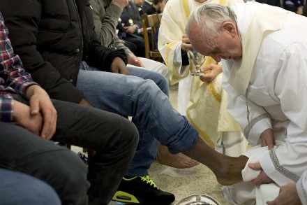 Pope Francis washes the foot of a young offender during last year's Holy Thursday Mass at Rome's Casal del Marmo prison (CNS) Below: A video of last year's ceremony (RomeReports)