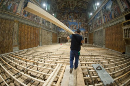 Workers prepare the Sistine Chapel for the conclave (Photo: CNS)