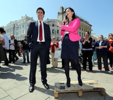 Ed Miliband and Hastings parliamentry candidate Sarah Owen claim victory in yesterday's elections (Photo: PA)