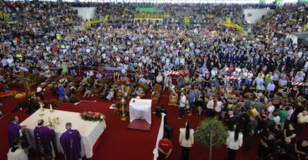 People crowd a sport hall set up for the funeral service of some of the victims of Sunday's bus crash, in Pozzuoli, near Naples (Photo: PA)