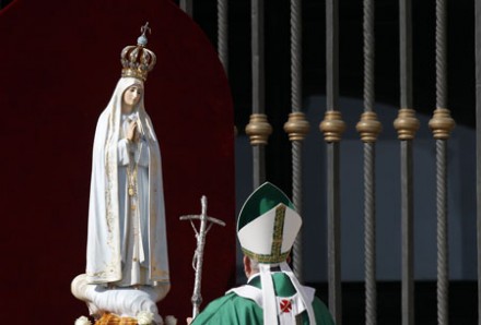 Pope Francis and the statue of Our Lady of Fatima (Photo: PA)