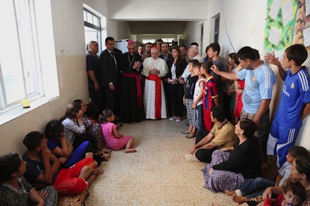 Cardinal Filoni visits a school sheltering displaced Christians and Yazidis (AP)