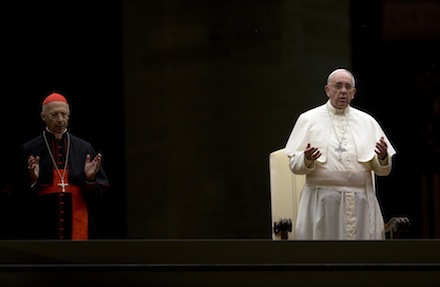 Francis and Cardinal Angelo Bagnasco pray during the vigil (AP)